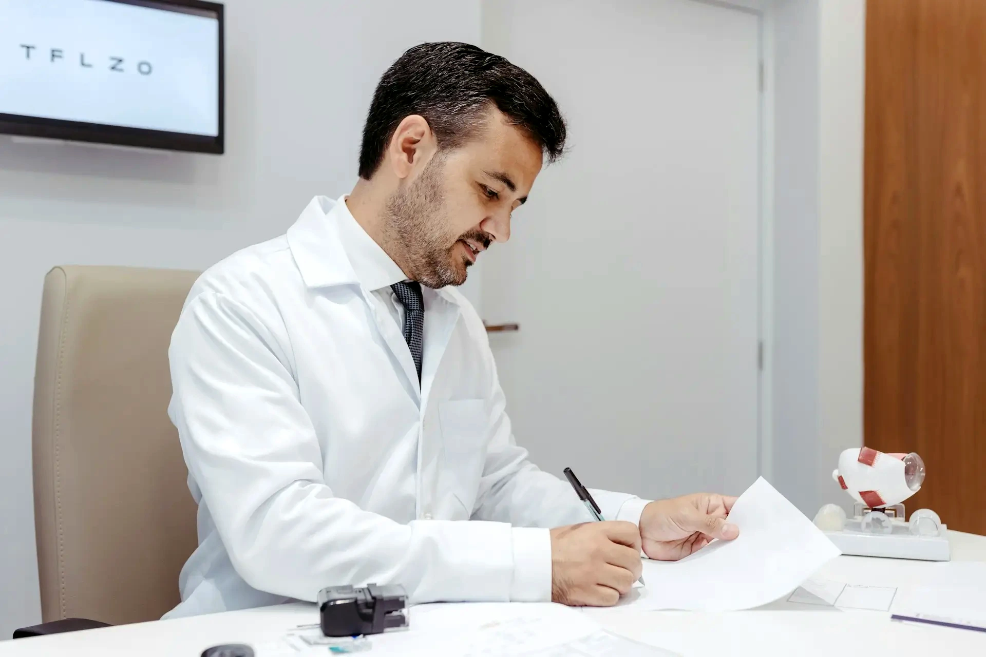 Physician reviewing tax strategy paperwork